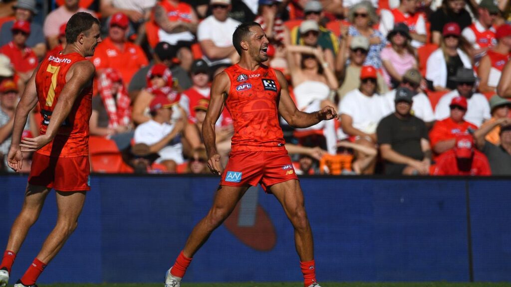 Ben Long (r) celebrates a goal with the Gold Coast Suns.