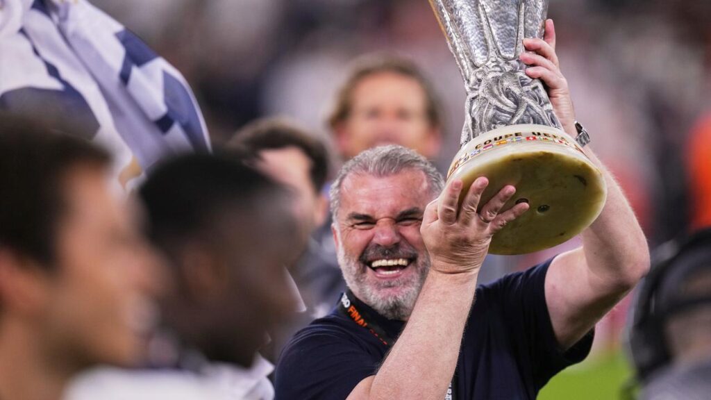 Ange Postecoglou celebrates with the trophy after Tottenham’s Europa League final triumph.