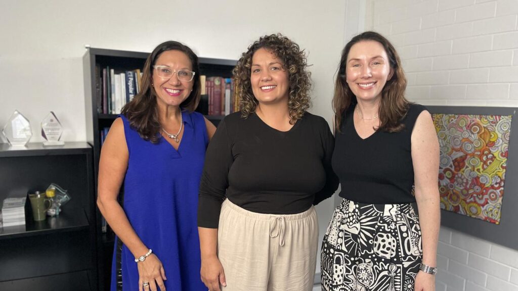 Musician Deline Briscoe (c), Anita Heiss and Katelyn Barney are safeguarding Indigenous languages.