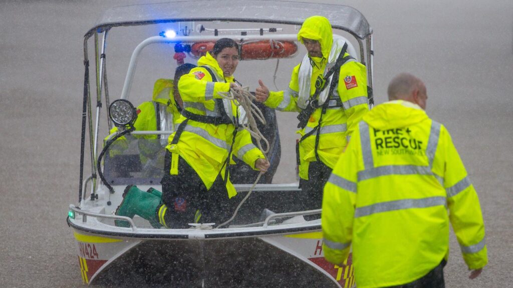 Three people have died and hundreds of residents rescued as floods wreak havoc in NSW.