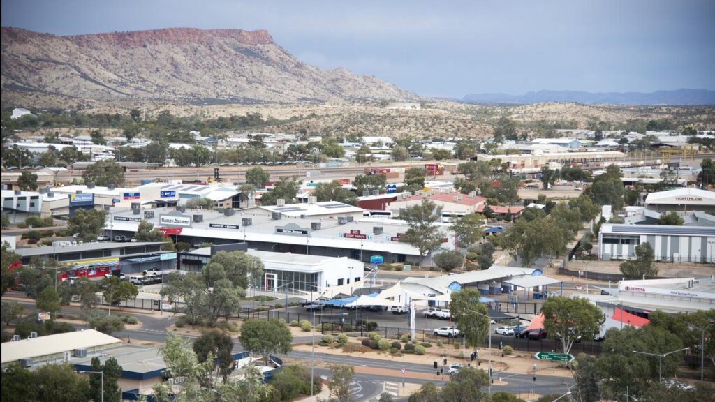 The man died after being restrained by police at an Alice Springs supermarket.