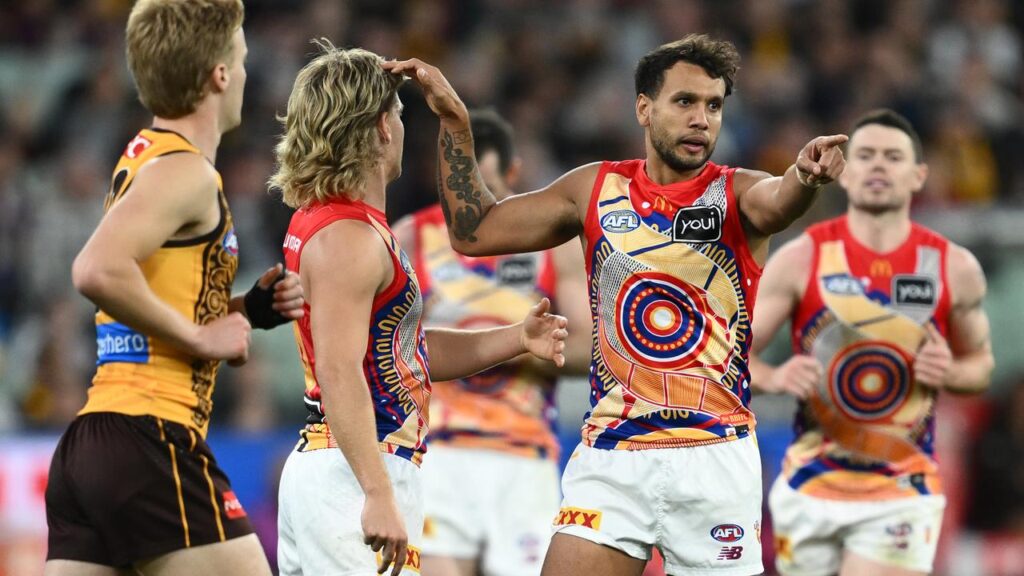 Brisbane’s Callum Ah Chee (second right) was outstanding with four goals in the win over Hawthorn.