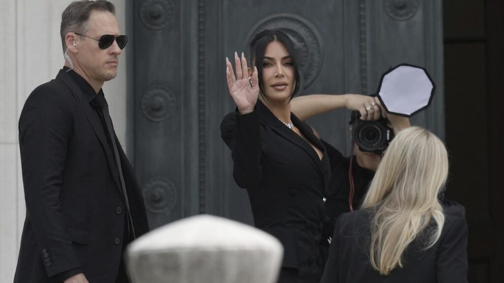 Kim Kardashian arrives at court to testify against men accused of a jewel robbery at gunpoint.