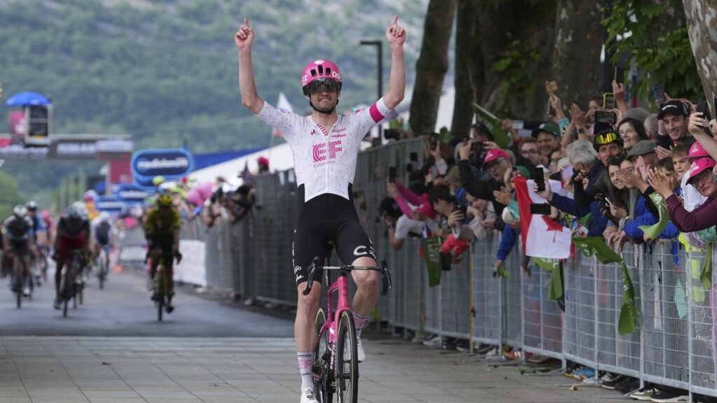 Kasper Asgreen wins the Giro’s 14th stage with Aussie Kaden Groves second amid the chasing bunch.