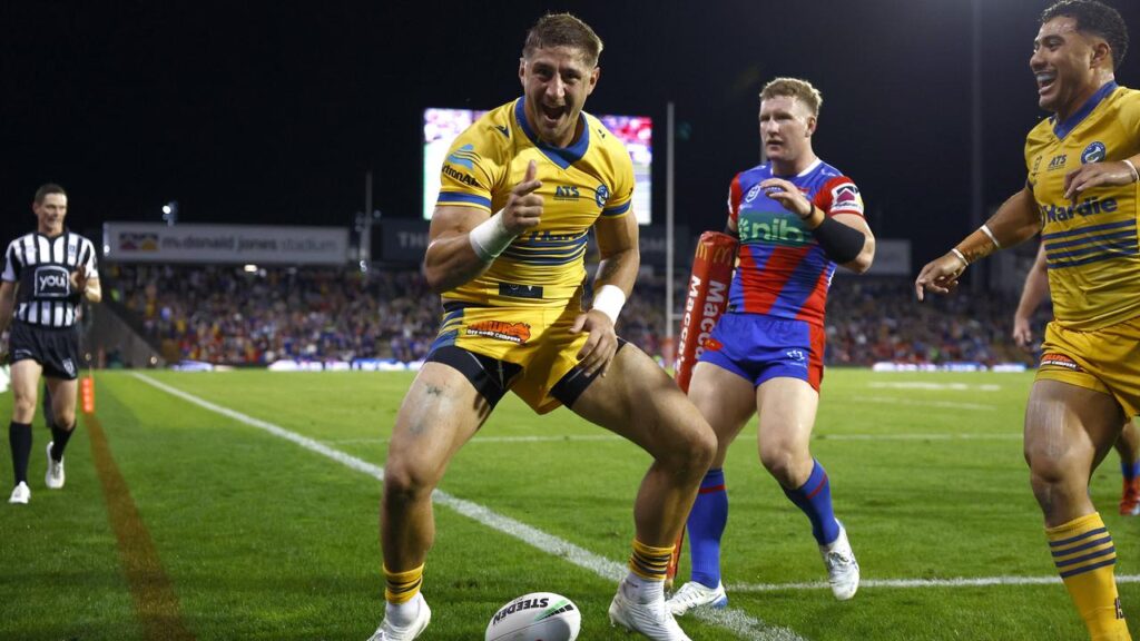 Zac Lomax celebrates one of his two tries for Parramatta as they thumped Newcastle.