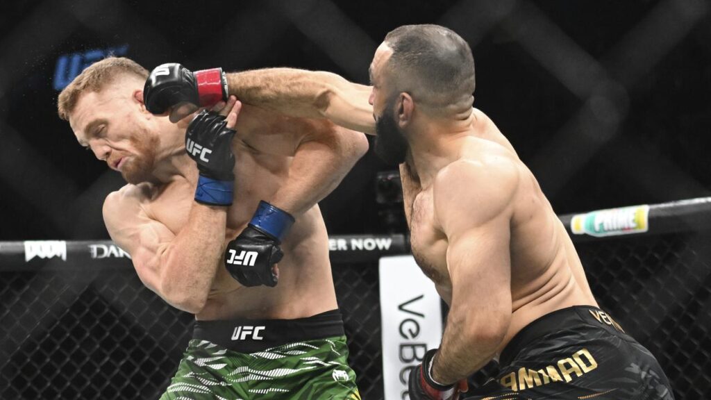Jack Della Maddalena (left) has defeated Belal Muhammad to win the world welterweight title.