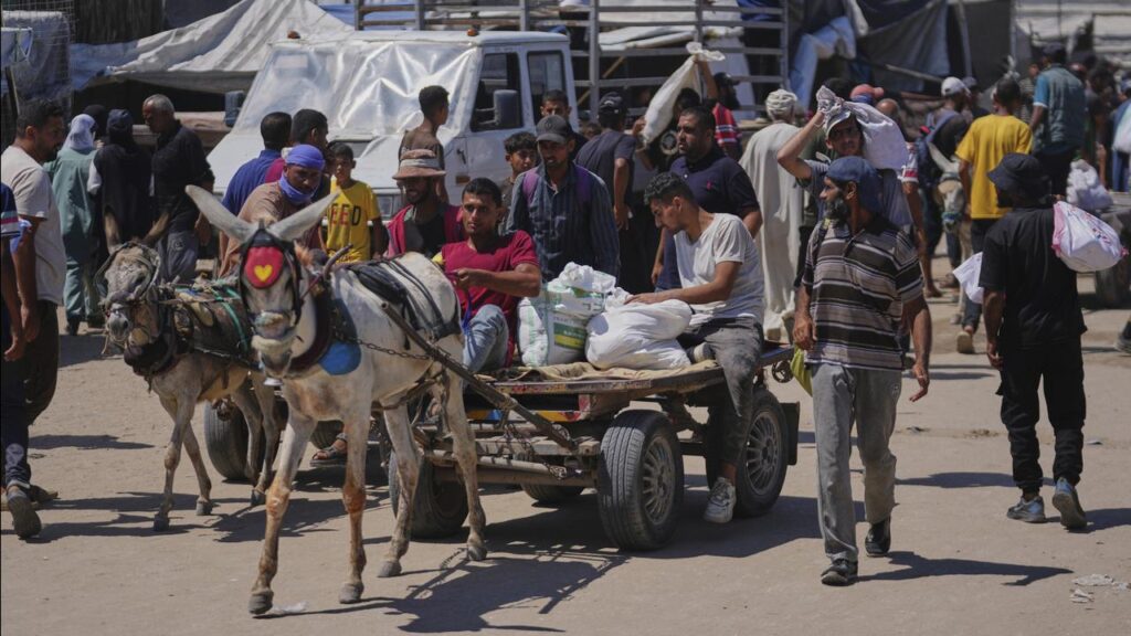 Palestinians have reported killings of people by Israeli fire as they waited at roadsides for aid.