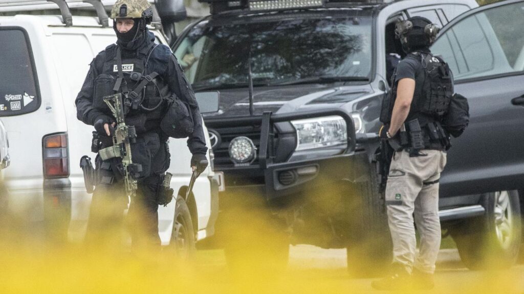 A coroner has heard a man was holding a gun he’d made before police shot him dead in a stand-off.