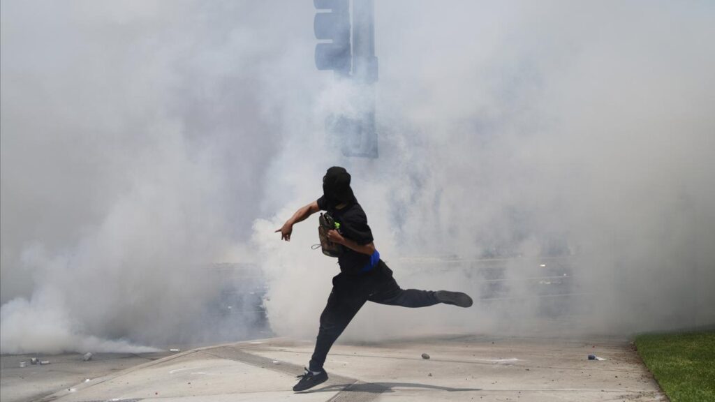 Protesters and federal police have clashed after immigration agents conducted sweeping raids.
