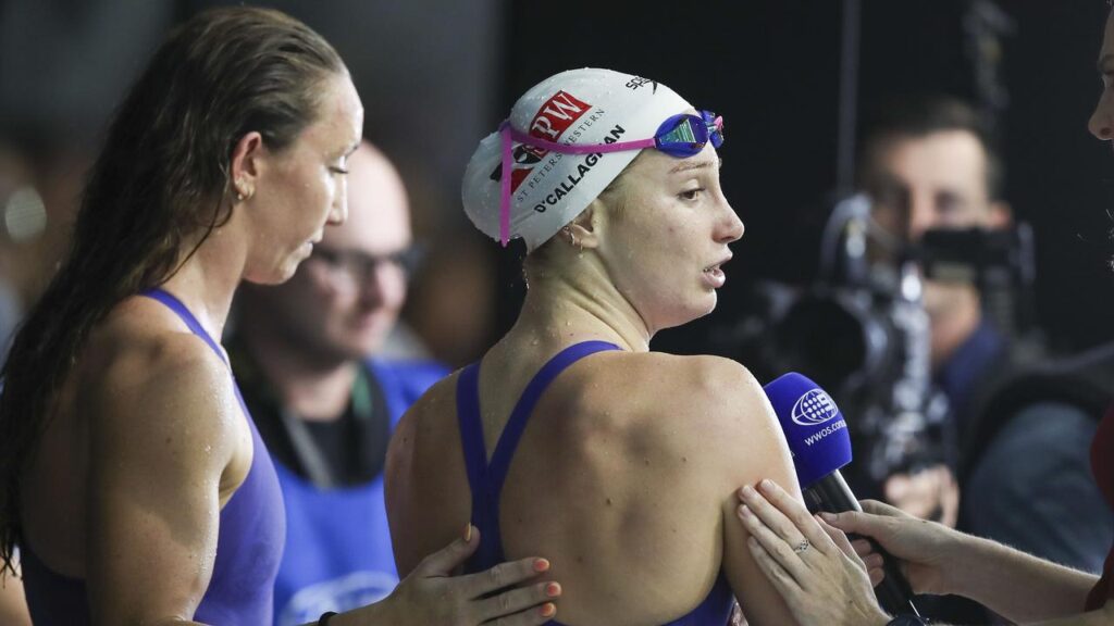 Lani Pallister (left) comforts Mollie O’Callaghan after she broke down poolside in Adelaide.
