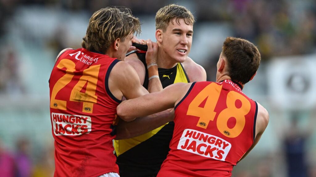 Adelaide players Josh Worrell (left) and Mark Keane were not happy with Richmond’s Tom Lynch.