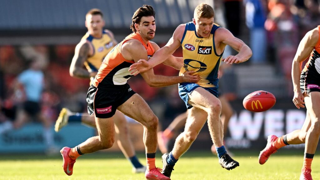 Matt Rowell (right) hasn’t yet re-signed with the Gold Coast, says coach Damien Hardwick.
