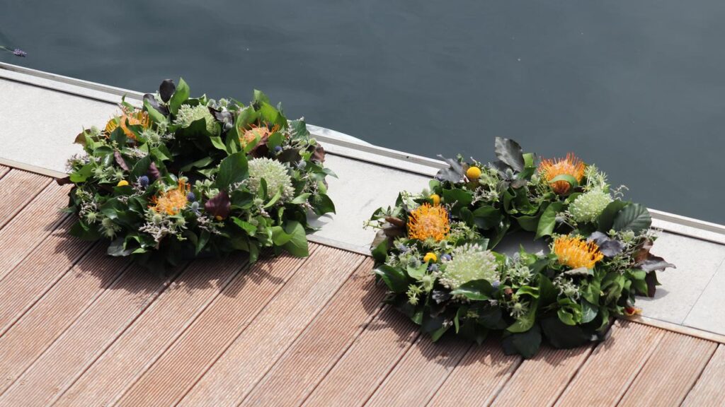 Wreaths were placed at Constitution Dock to honour the sailors who died in the 2024 Sydney-Hobart.