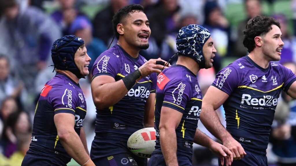 Eli Katoa (second left) opened the scoring for the Storm in the win over Cronulla.