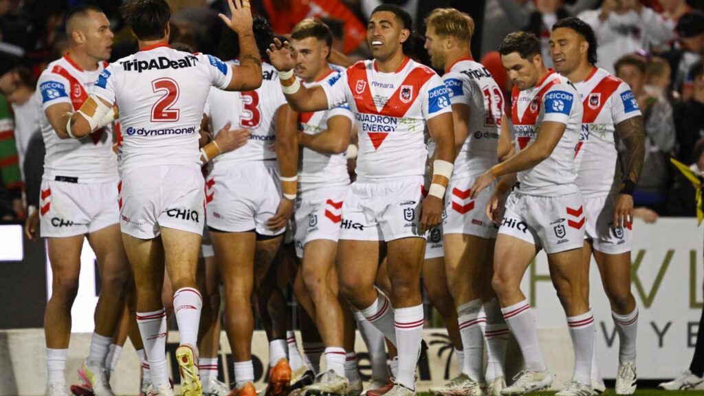 The Dragons celebrate a try by Nathan Lawson who ended the night with a shoulder injury.