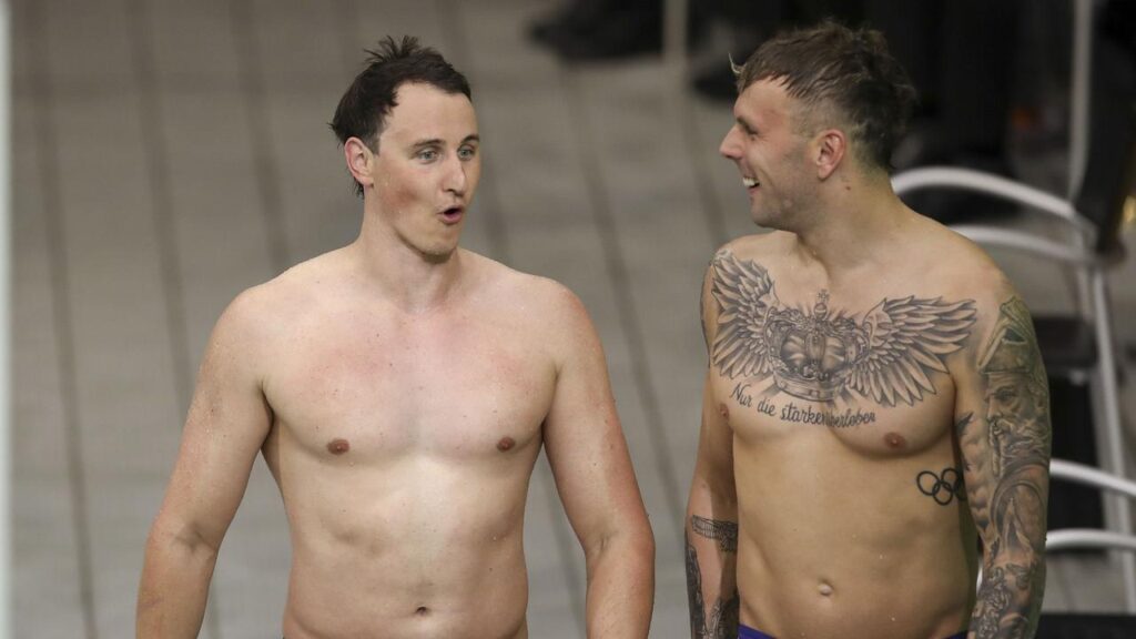 Cam McEvoy (left) and Kyle Chalmers share a smile after qualifying for the world championships.