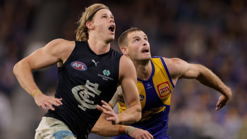 Carlton’s Tom De Koning (left) won’t be rushed into a decision on his future by coach Michael Voss.