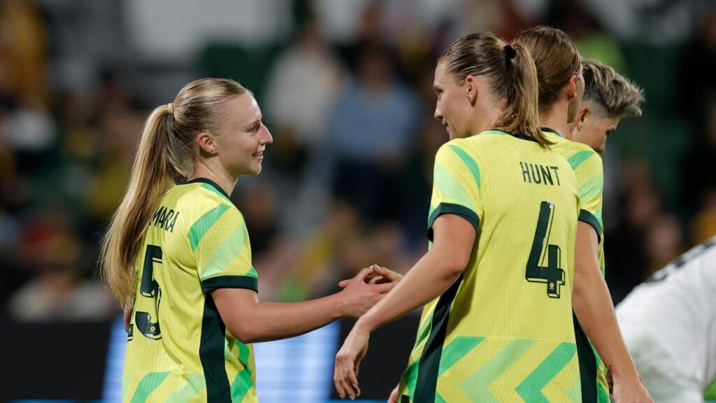 Holly McNamara (L) being congratulated after her maiden international goal in the win over Slovenia.