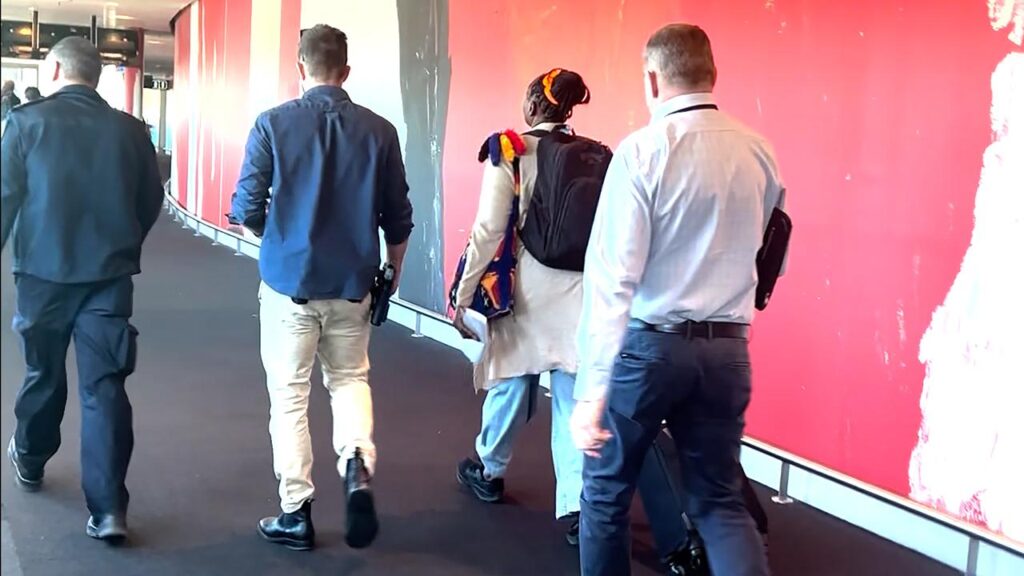 A PNG-based woman was arrested over the allegations when she arrived at Brisbane Airport.