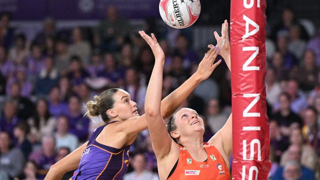 The Giants’ Jo Harten (right) marked her 200th match with a thrilling win over the Firebirds.