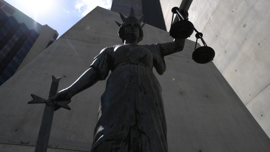 A one-punch killer was back in court for assaulting hospital security staff and a fellow inmate.