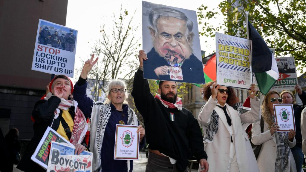 Protesters waved pictures of Israeli Prime Minister Benjamin Netanyahu drinking “Gazan blood”.
