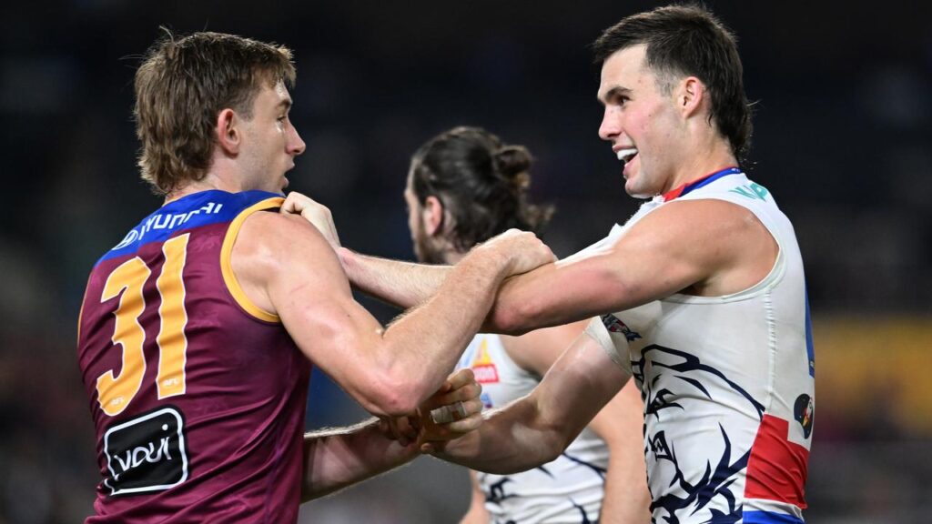 Sam Darcy (right), of the Bulldogs, gets to grips with Harris Andrews of the Lions.