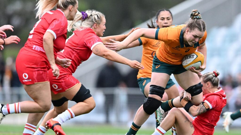 Australia’s Kaitlan Leaney takes it up to her Welsh opponents in the Test in Brisbane.
