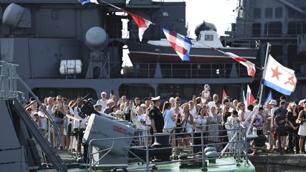 People gather as Russian President Vladimir Putin visits the frigate “Admiral Grigorovich” .