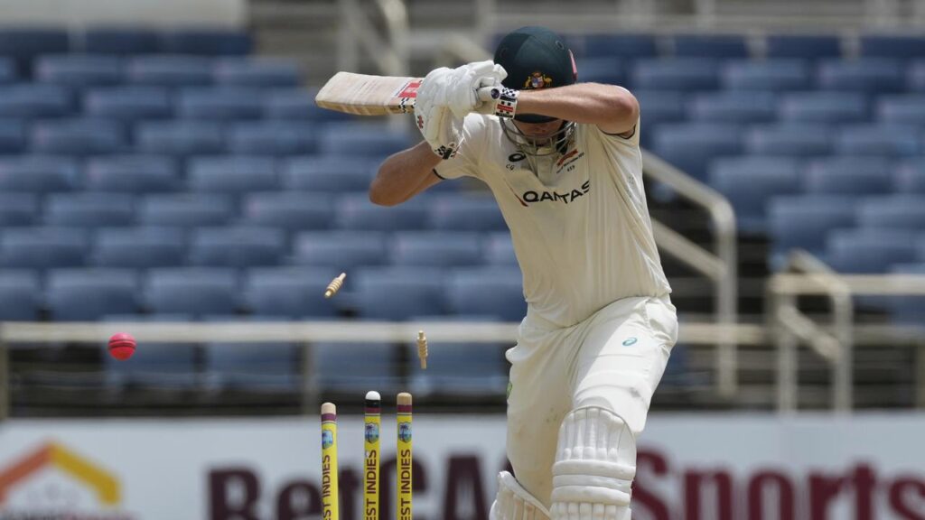 Australia’s Cameron Green is bowled by West Indies’ Shamar Joseph after shouldering arms.