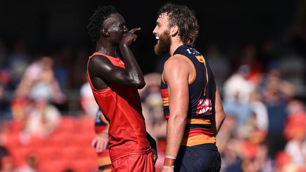 Gold Coast’s Mac Andrew taunts Adelaide’s Riley Thilthorpe after their round-four thriller.