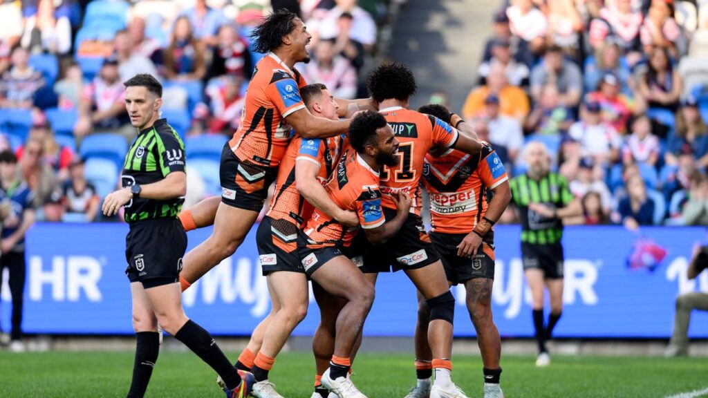 Wests Tigers have snapped a six-game losing streak with a thrilling win over the Roosters.