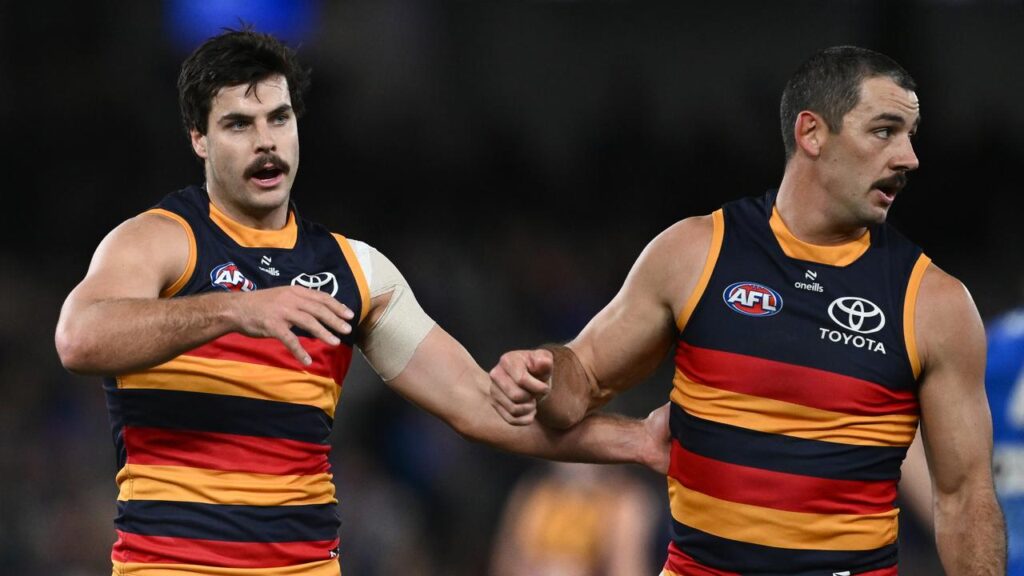 Fellow forward Darcy Fogarty (L) celebrates a goal with Taylor Walker against the Western Bulldogs.
