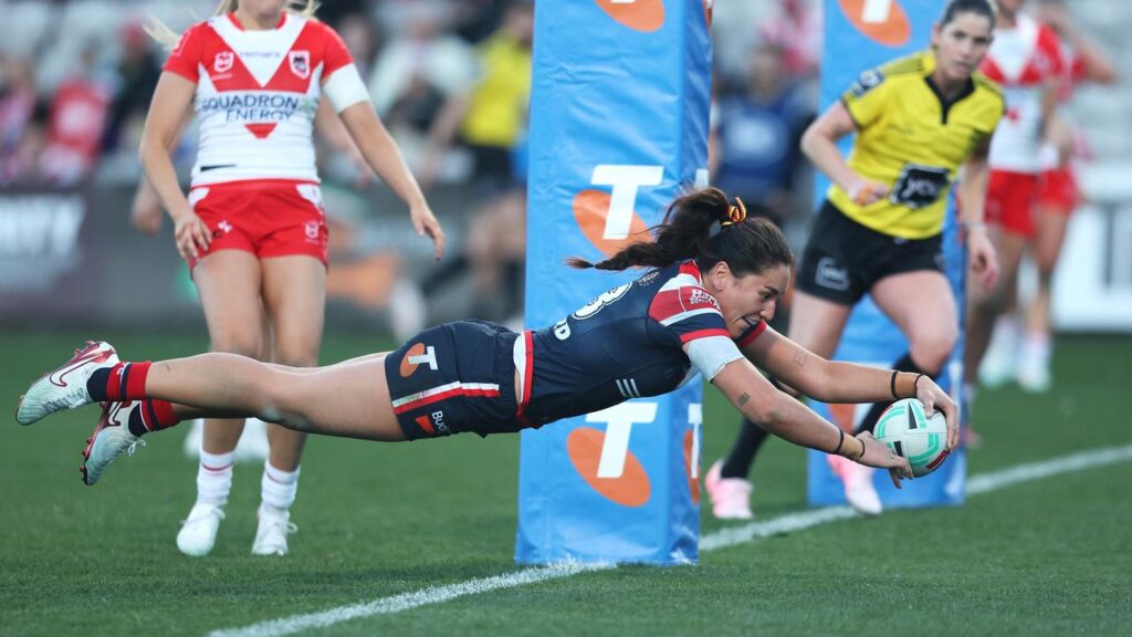 Olivia Kernick soars through the air to score in the Roosters’ win over the Dragons.