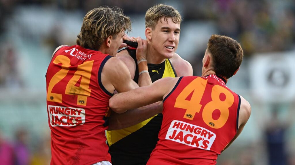 Adelaide players remonstrate with Richmond’s Tom Lynch after his strike on Crow Jordon Butts.