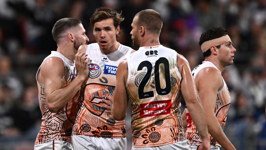 Aaron Cadman (centre) kicked six goals in the Giants’ 26-point win over the Cats.