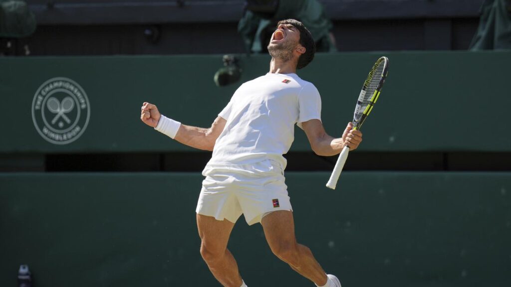 Champion Carlos Alcaraz celebrates after beating Taylor Fritz in the Wimbledon semi-final.
