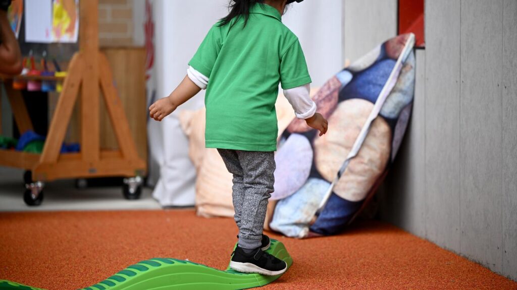 A 26 year old worker in after-school care has been charged with producing child abuse material .