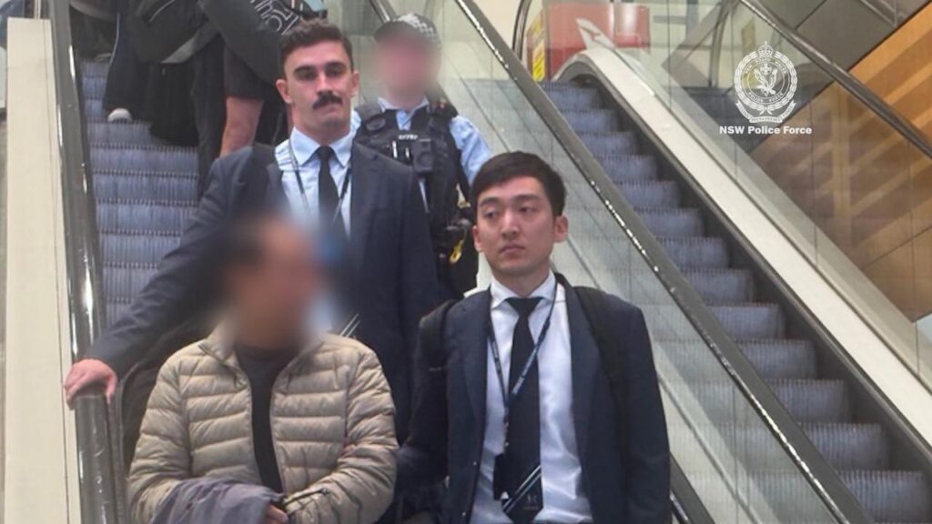 A man (bottom left) has been charged over a blessing scam targeting elderly Chinese women.