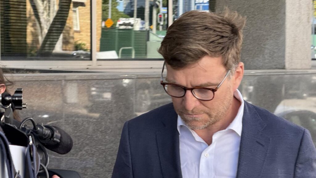 Police confirm former bank executive Christopher James McCann was found dead at his bail address.
