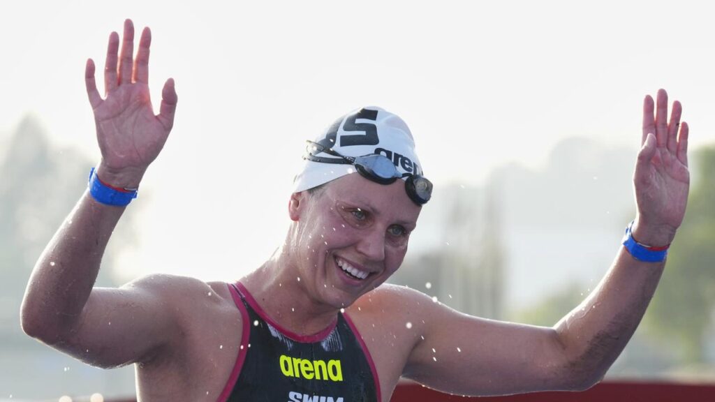 Australian Moesha Johnson celebrates after her historic 10km open water world title.