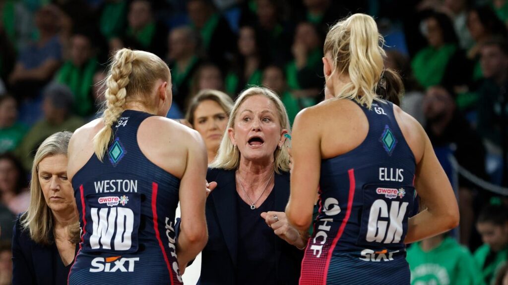 Emotions are high with Melbourne Vixens coach Simone McKinnis (c) to depart after the grand final.