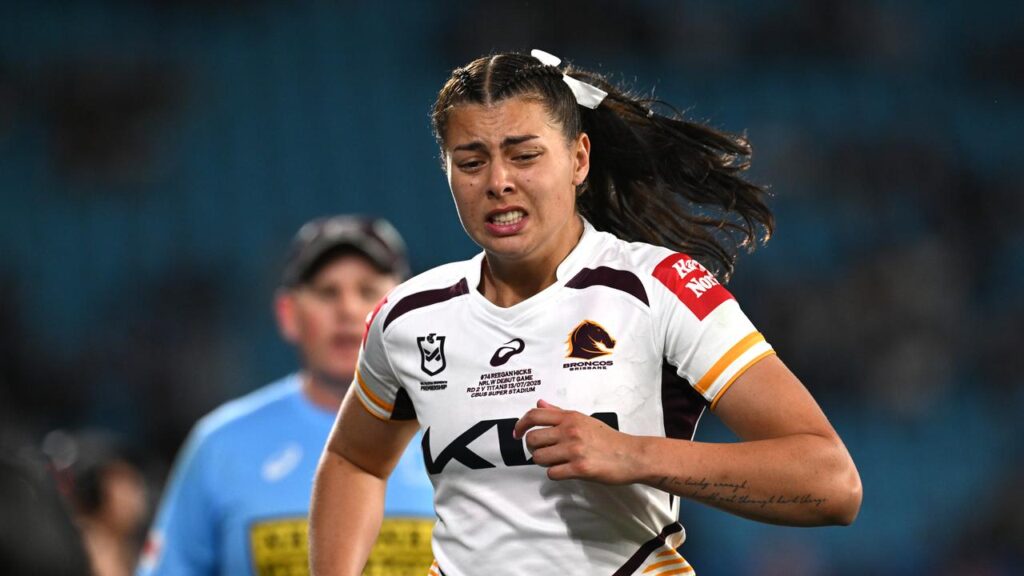 Brisbane debutant Reegan Hicks leaves the field after being sent off against Gold Coast.
