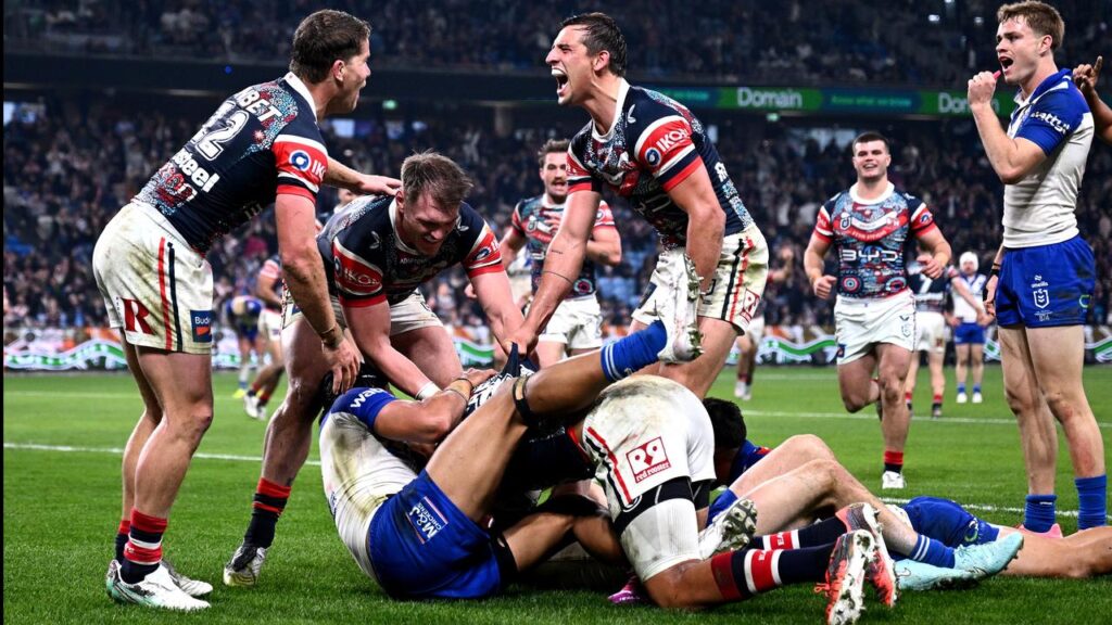 Daniel Tupou (obscured) scored three tries as the Roosters upset the Bulldogs at Allianz.
