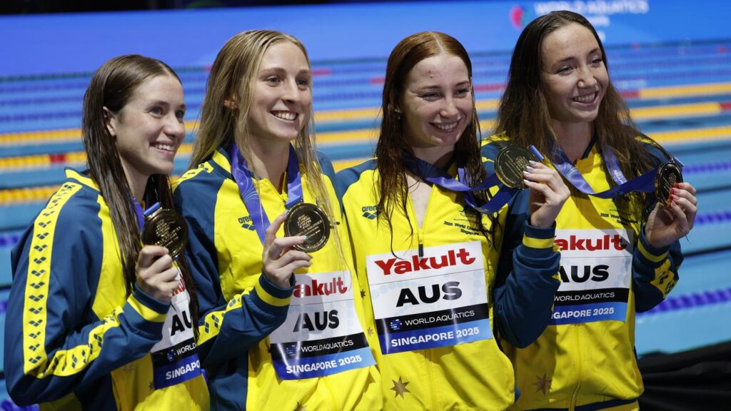 Mollie O’Callaghan and her teammates show off their 4x200m freestyle relay gold medals.