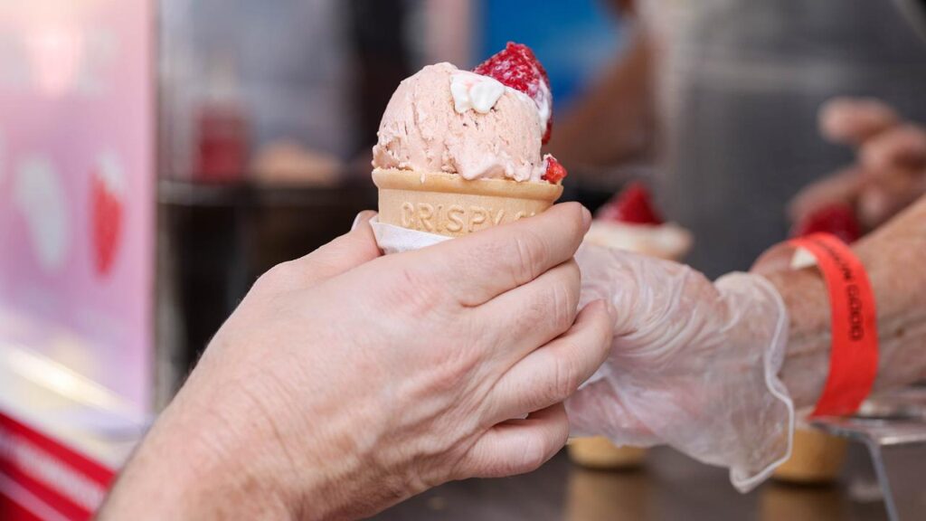 Enjoying a strawberry sundae has become a rite of passage for crowds at Brisbane’s Ekka.
