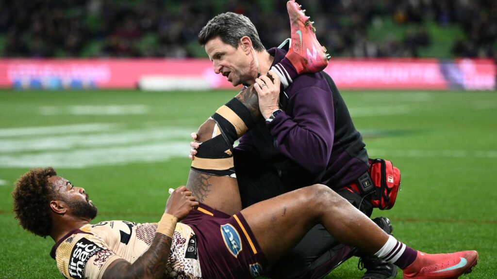 Brisbane playmaker Ezra Mam is checked after suffering his hamstring injury against Melbourne.
