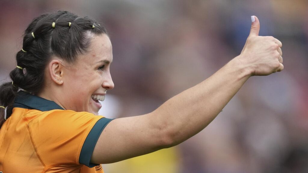 Desiree Miller celebrates her hat-trick of tries in Australia’s rout of Samoa in the World Cup.