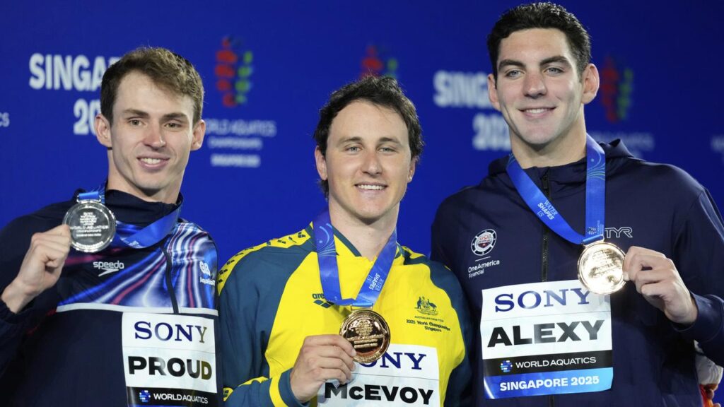 Australia’s Cam McEvoy shows off his 50m freestyle gold medal at the world titles in Singapore.
