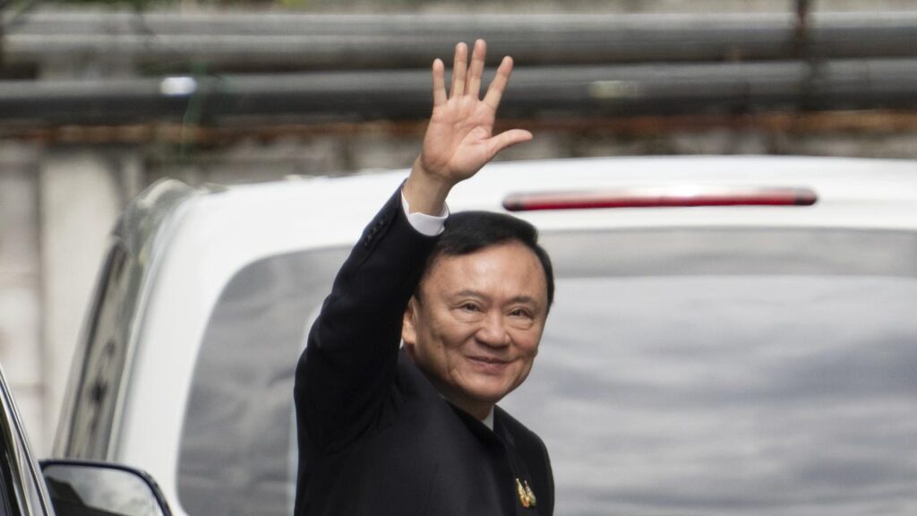 A smiling Thaksin Shinawatra announced his not guilty verdict outside court in Bangkok.